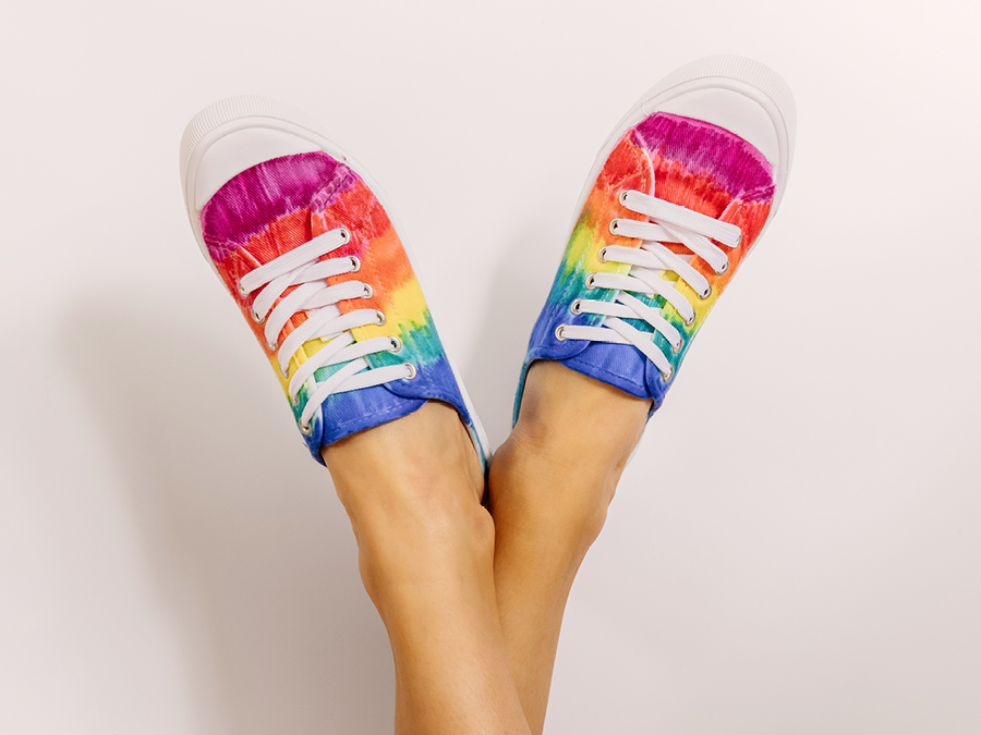 Multi-coloured DIY sneakers on feet