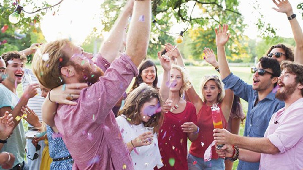 A group celebrating together outdoors 