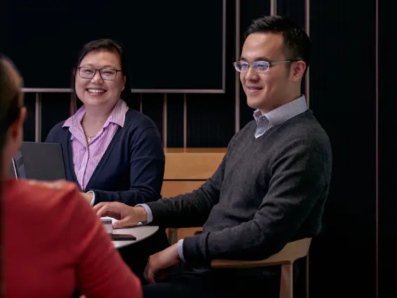 Perofessionals sitting in a meeting room