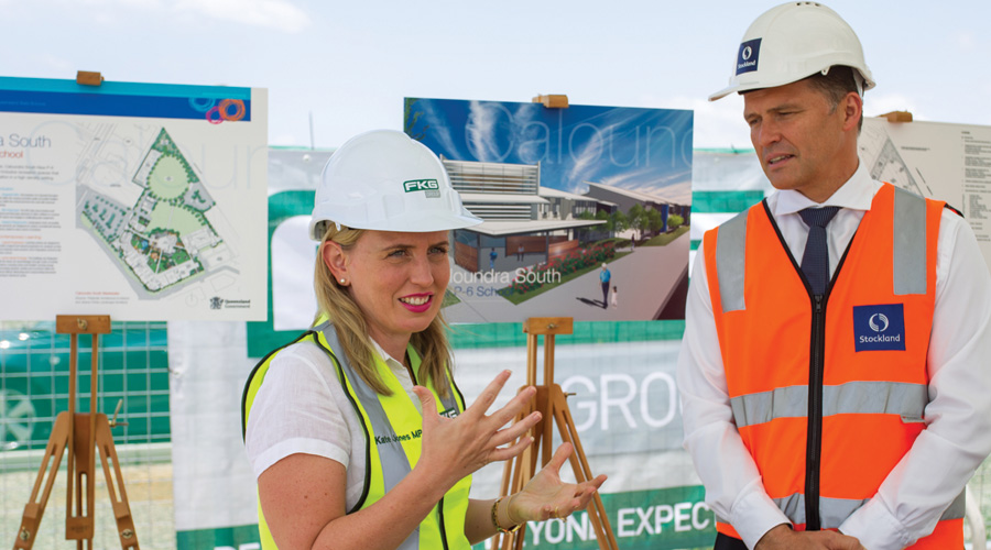 The Hon Kate Jones, Queensland Minister for Education and Special Events, with Kingsley Andrew, Stockland General Manager Residential Queensland, attend the sod turn for the new Aura school.