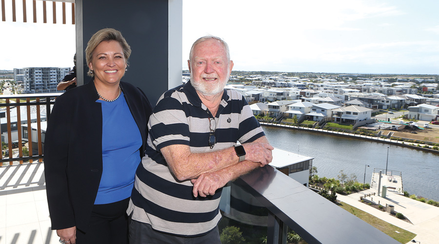 Pauline Barton, Regional Development Manager Stockland, and future resident Peter Billingham enjoy the view at Birtinya Retirement Village.