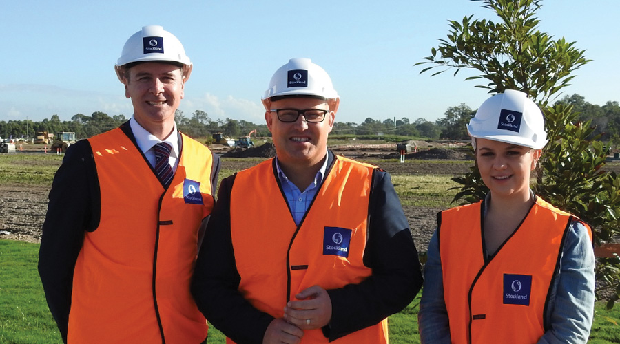 Queensland Treasurer the Hon. Curtis Pitt (C), with Stockland's David Laner (L) and Pallara first home buyer Diana (R).