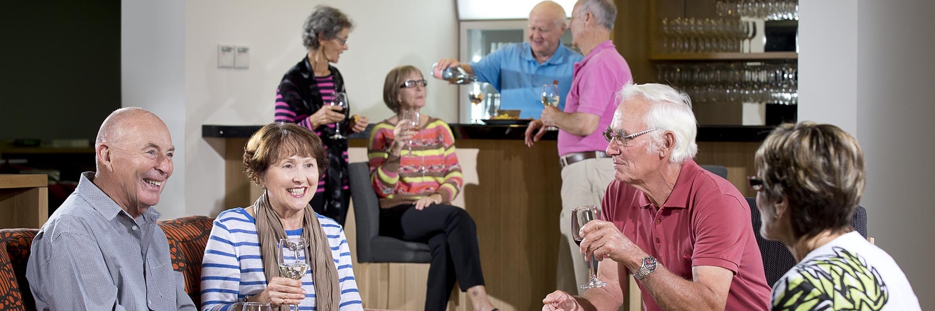 Group of homeowners enjoying each others company in the Rec Club over drinks and nibbles