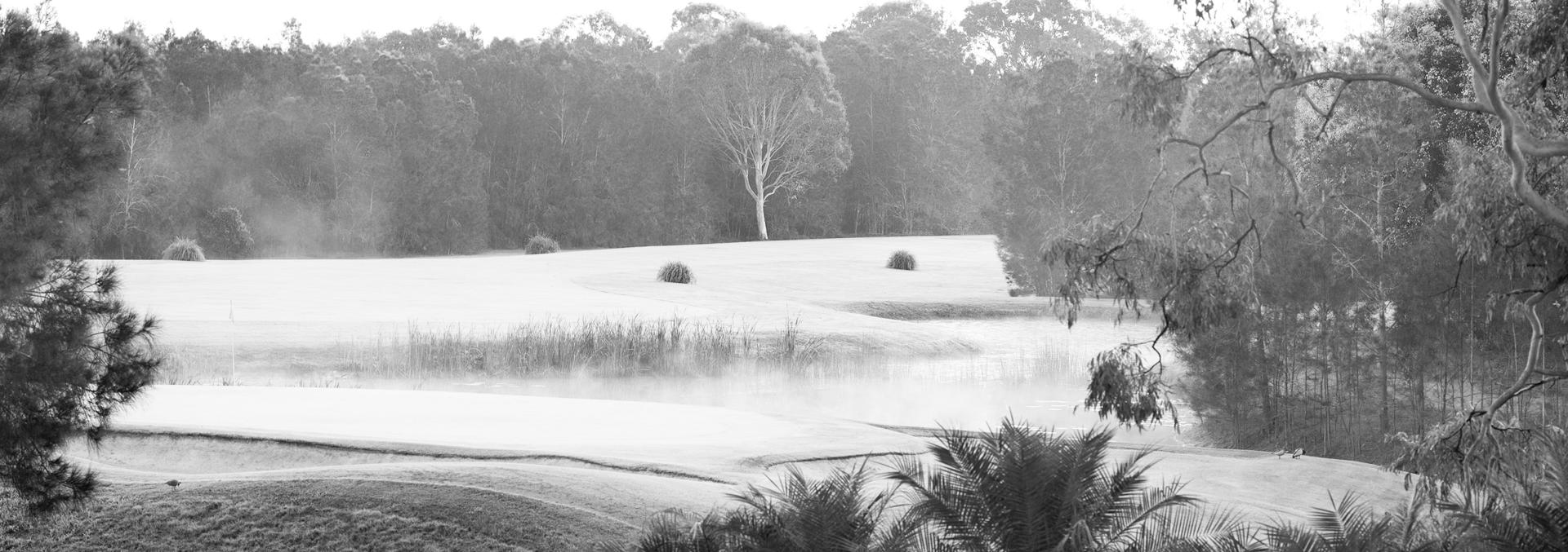 Landscape shot of the golf course and steamy lake