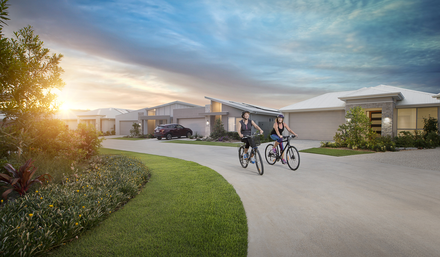 Homeowners riding their bike through the streets of Halcyon
