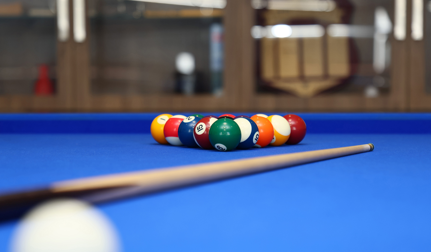 Halcyon Ridge close up pool table focused on cue and balls.