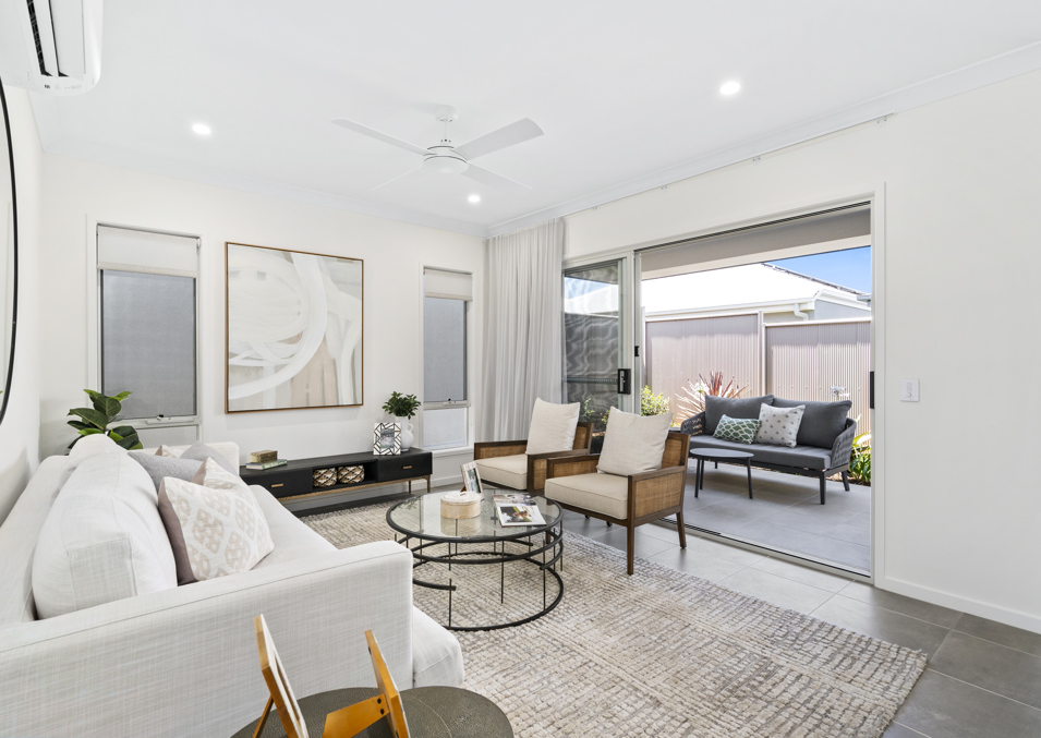 A modern lounge with display furniture at one of the display homes at Halcyon Rise.