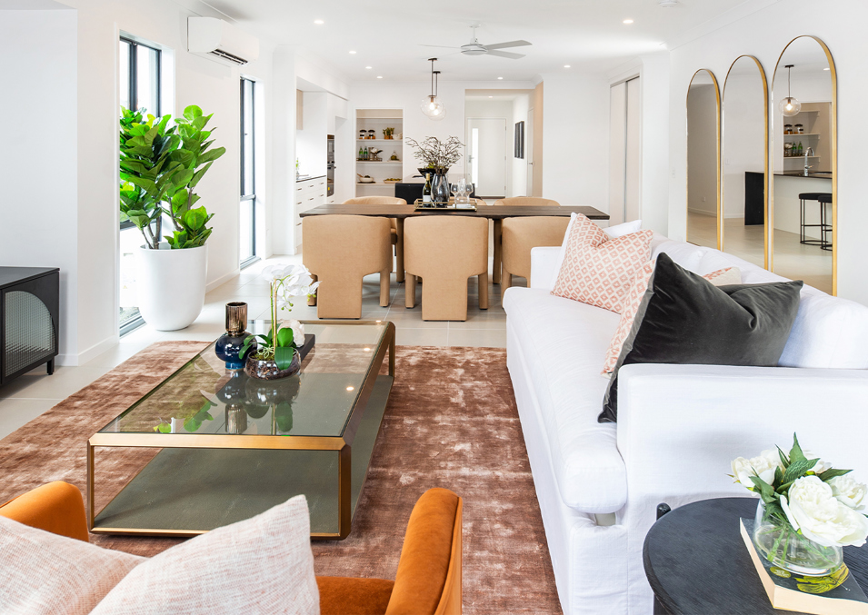An internal render of the lounge area with modern display furniture at one of the display homes at Halcyon Rise.