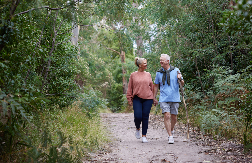 A couple in their 60s taking a walk in the pathways at Halcyon Rise.