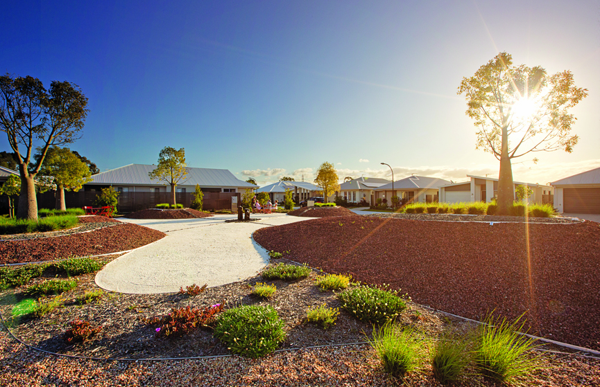 An external shot of the homes at Halcyon Glades in Caboolture with trees lining the homes