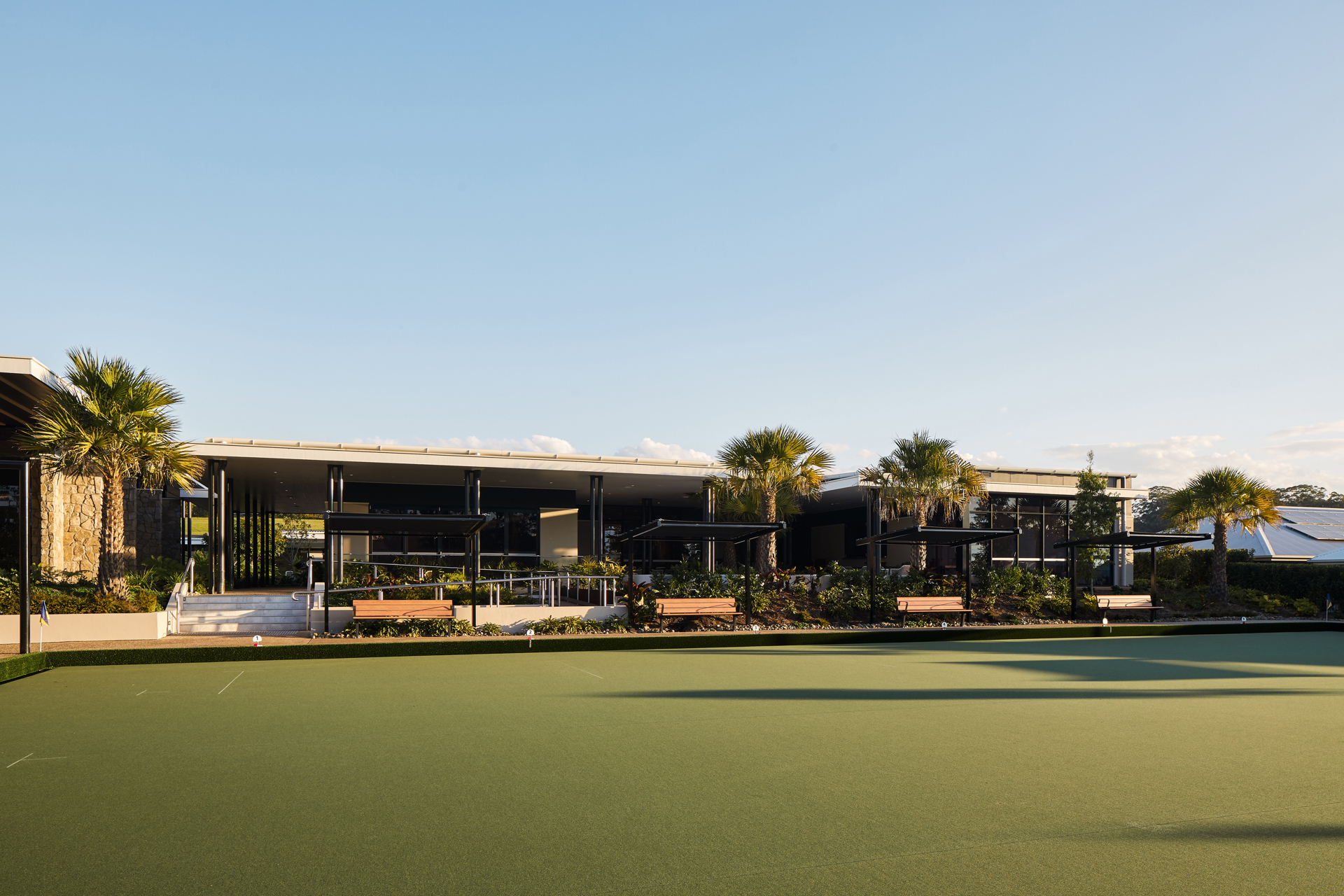 Full sized bowling green with outdoor creative arts courtyard area in B by Halcyon over 50s lifestyle living community on the Sunshine Coast.