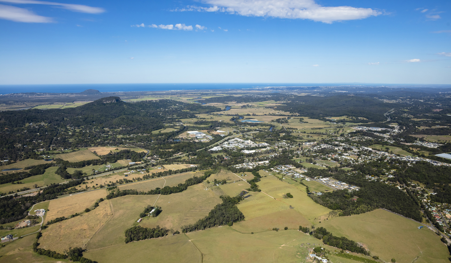 aerial image of small town in Queensland Yandina overlooking the mountains and through to the coastline