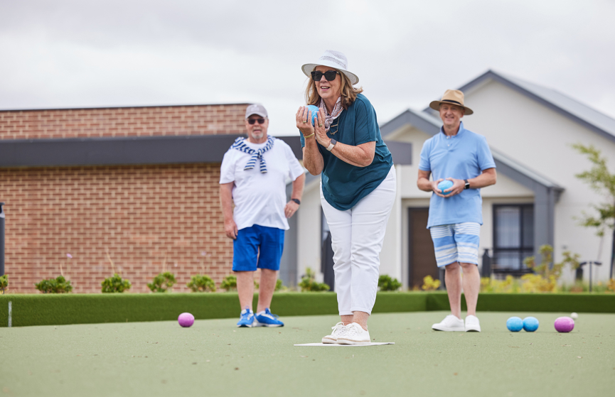 A group of Berwick homeowners playing lawn bowls at the Clubhouse