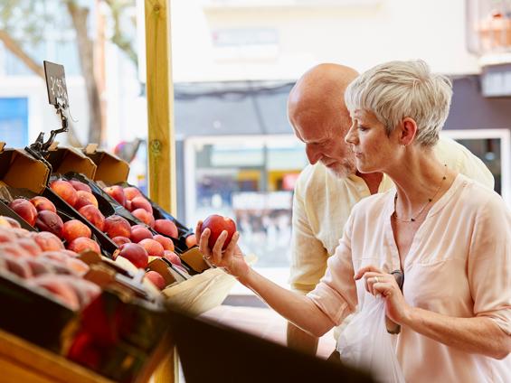 A couple enjoying fruit shopping together