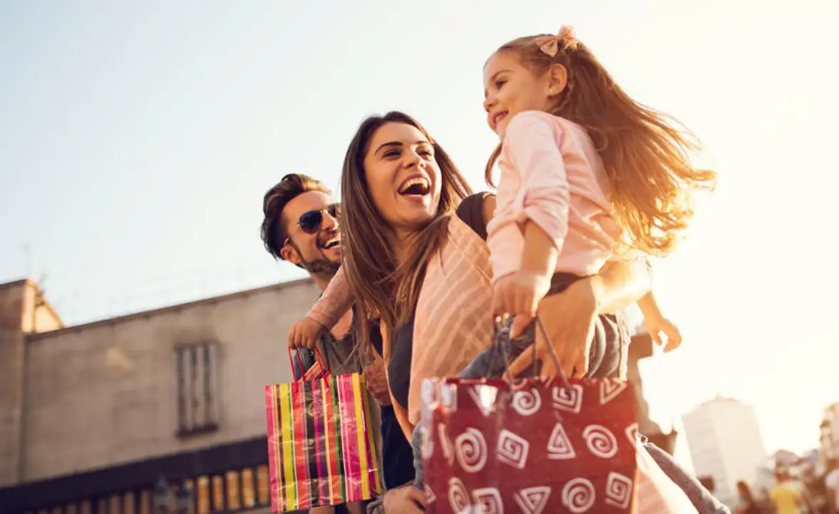 Happy young family shopping