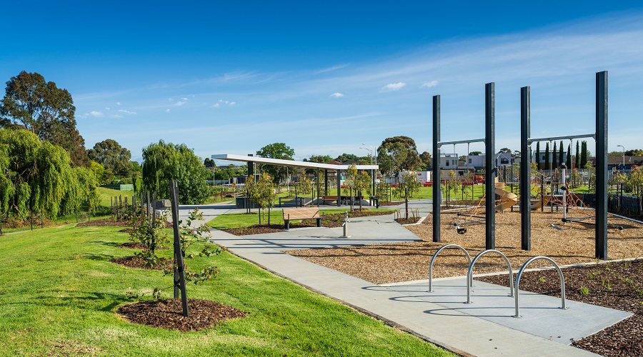 Kids playground with swings, slides and climbing rope