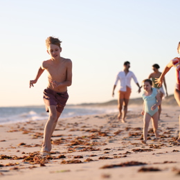 Kids running on beach