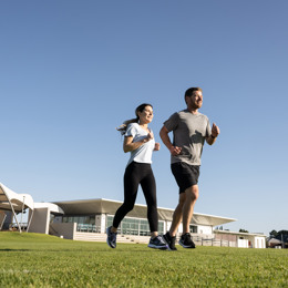 Couple running on oval