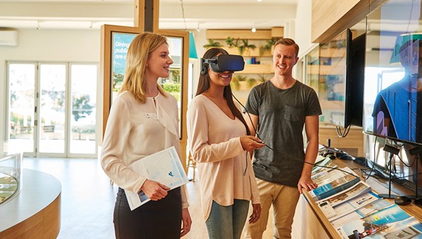 Customers use virtual reality to explore the future lake at Stockland's Newport residential community in Newport, Qld.
