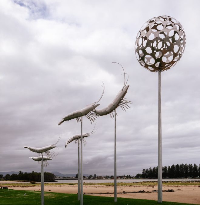 Metal sculpture of prawns in the sky. 