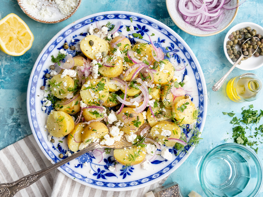 Greek potato salad with red onions and feta