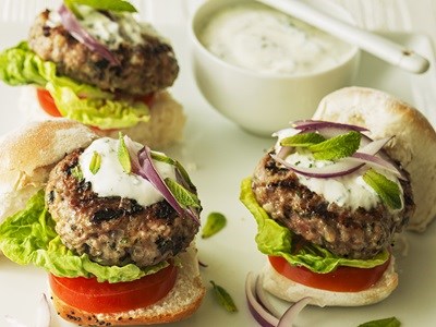 Mini burgers with lettuce, tomato and red onion