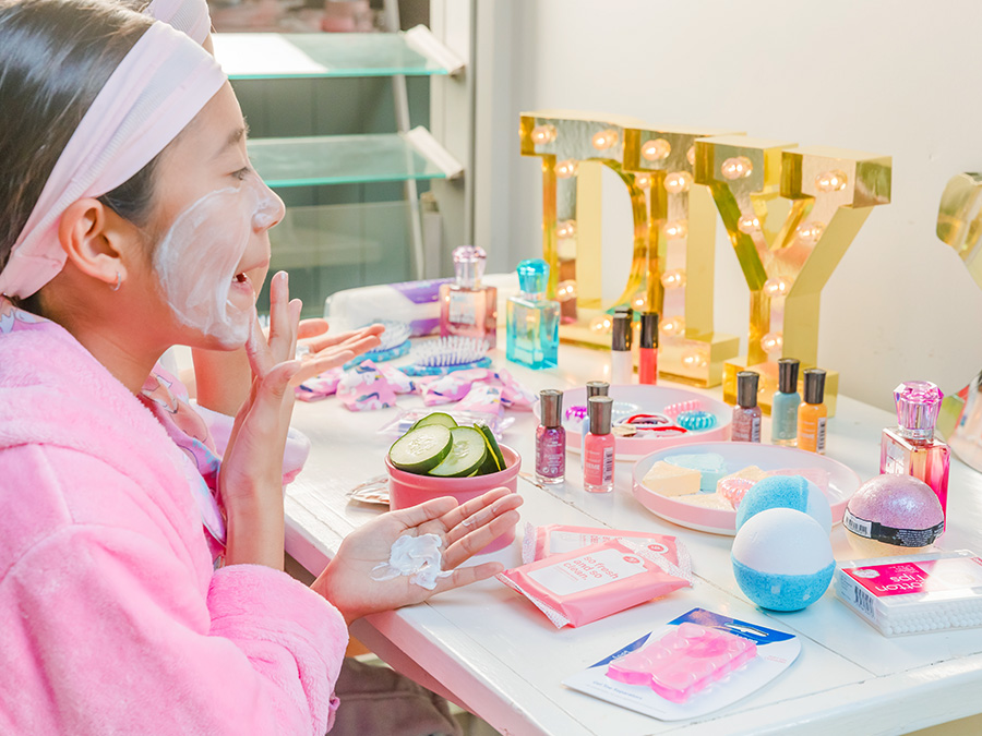 Young girl using beauty products