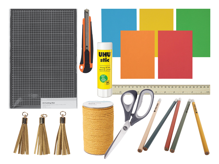 Craft items including scissors, paper, colourful paper, ruler, and pencils