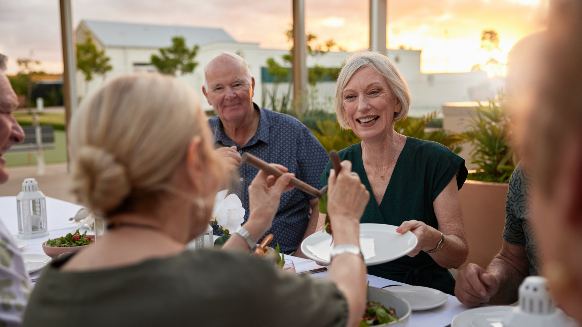 Halcyon Nirimba friends enjoying BBQ dinner at sunset