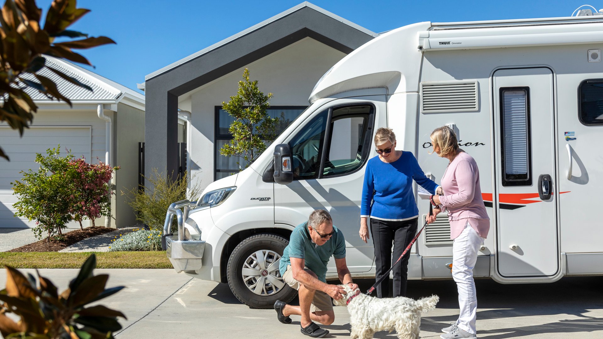 Halcyon Greens couple arriving back from holiday with their caravan and dog