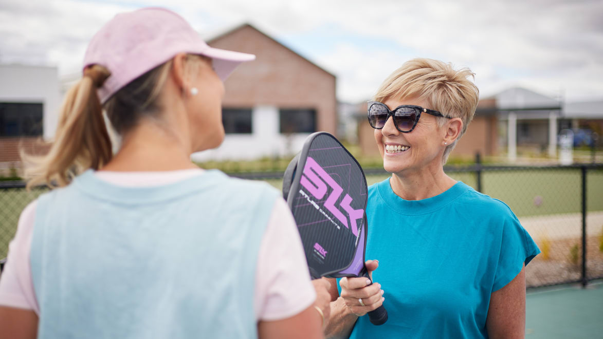 Friends play a round of pickleball at Stockland Halcyon Berwick