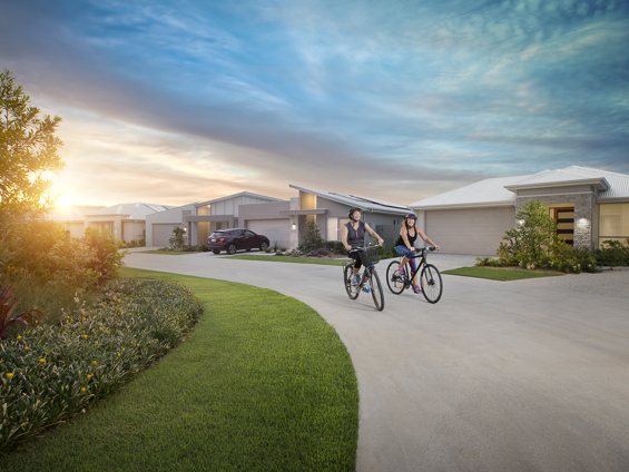 2 ladies ride bikes in the Stockland Halcyon Lakeside community