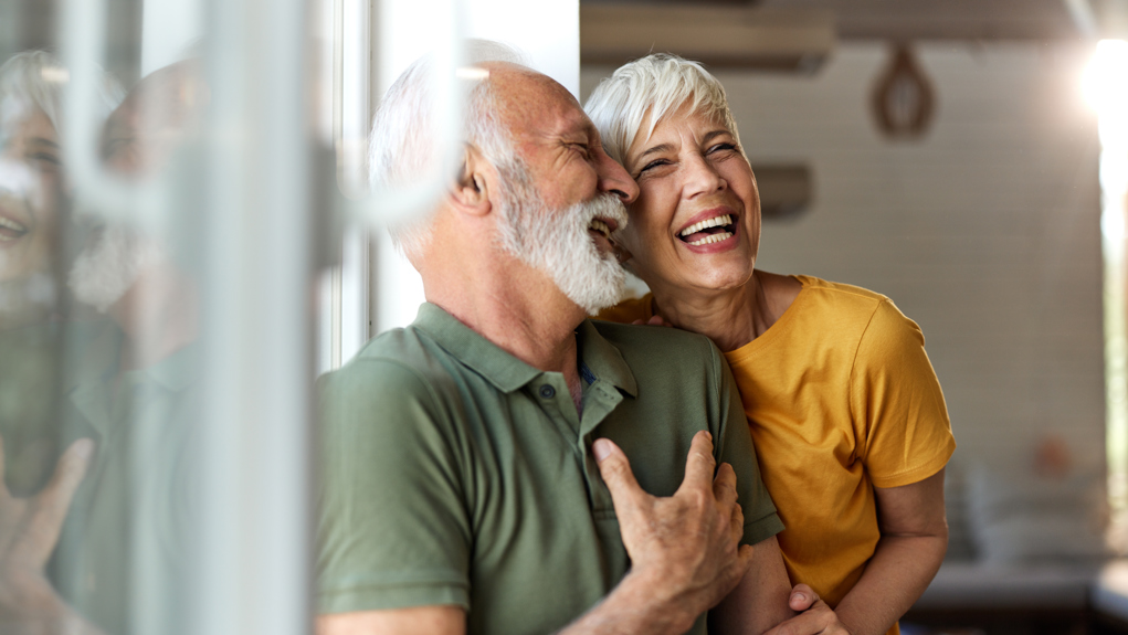 Couple laughing and smiling at each other