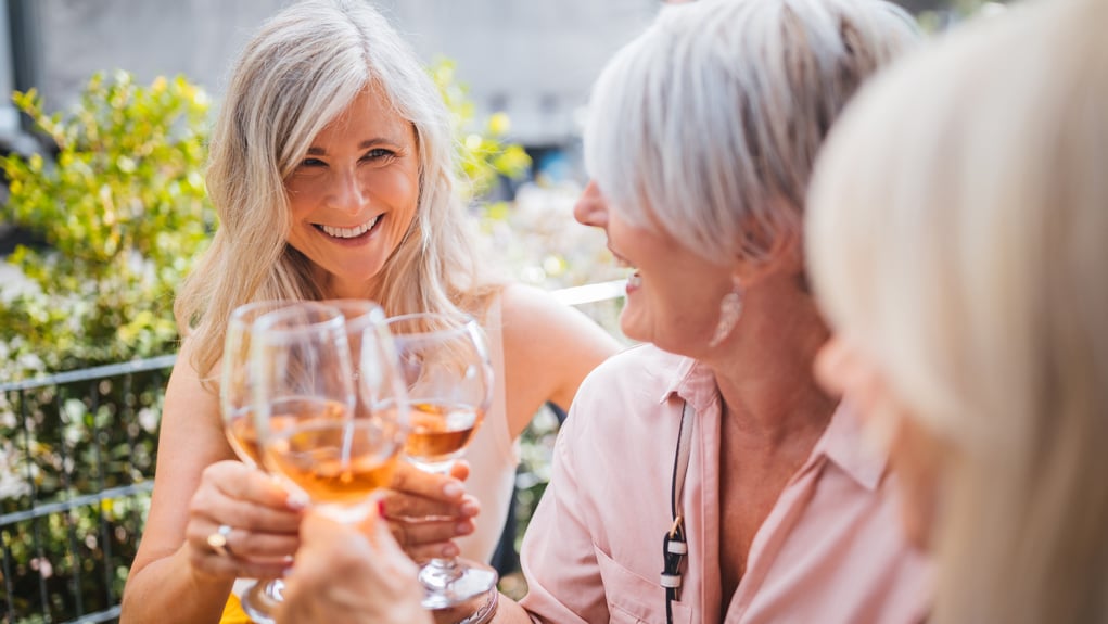 Friends get together to socialise and enjoy a drink