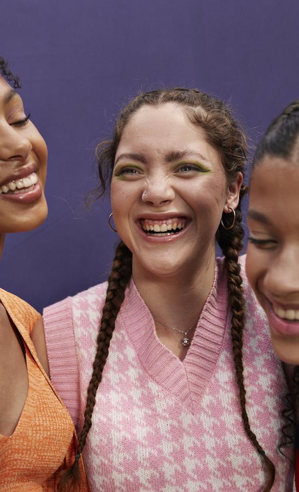 Three women smiling